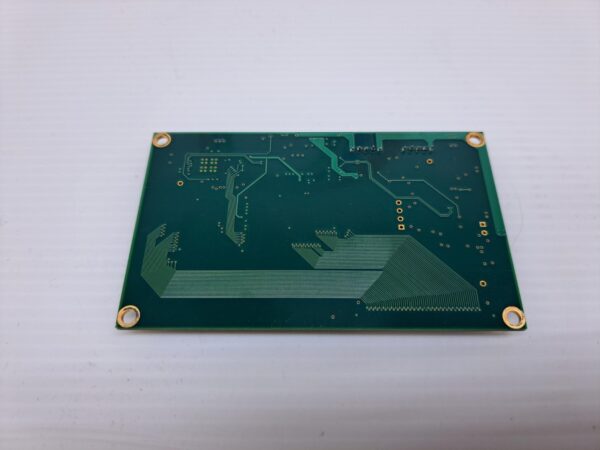 A green PCap Touch Controller for Aristocrat Helix Games. Part TP270CUC3B on a white surface.