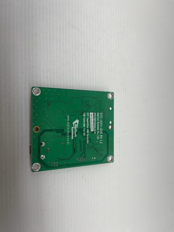 A Touch Sensor Controller, SCT, DigiTech Brand green pcb, designated as DTC-02U-01, fitting IGT Netplex units, is positioned on a white surface.