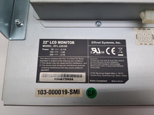 The back of a 22" Effinet LCD Monitor for a Shuffle Master game with a label on it.