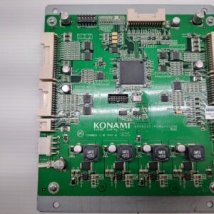 A green Power Control board for use with Konami Games on a white surface.
