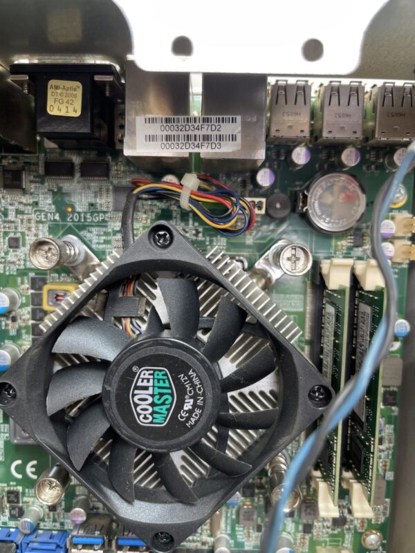 A close up of a CPU for use with AGS Orion Games with a fan attached to it.