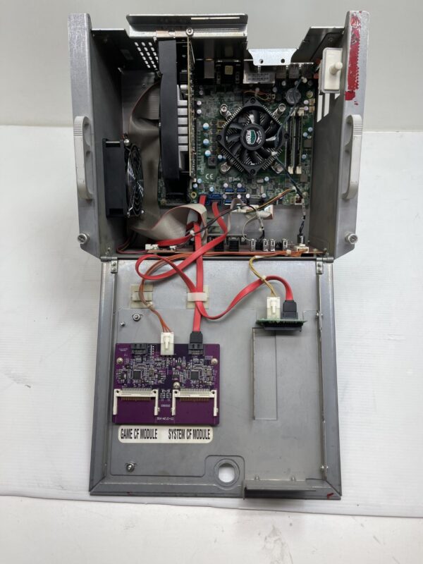 The inside of a computer case with a CPU for use with AGS Orion Games inside. AGS Part 00032D34F7D2. Refurbished, cleaned, tested, GETT your game back to work! GETT Part CPU212
