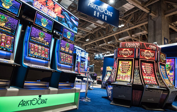 A casino with many Touch Virtual Button Deck for the ARISTOCRAT HELIX + Upright slot machines on display.